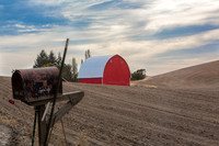 Mailbox and red barn