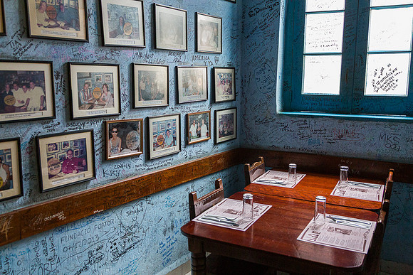 Photos and writing on the restaurant wall, Havana, Cuba