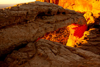 Yellow Sunrise behind Mesa Arch