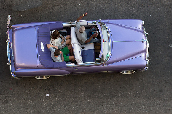 Taking a ride in a 1950's purple Chevy