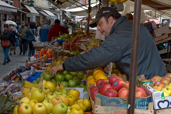 Venice Fruit Vender Tending Merchandise