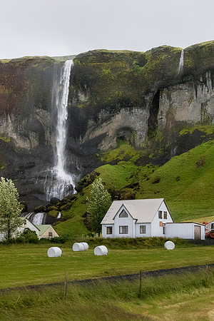 White farm house by Foss a Sidu Waterfall