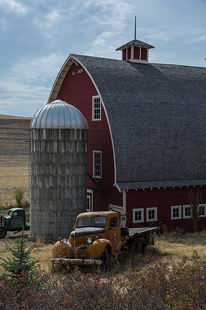 Red barn and yellow truck