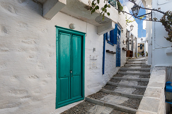 Ano Syros stepped walkway with green door
